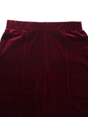 Burgundy velvet palazzo trousers with seam detail and elastic waistband.
