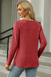Red marled knit long sleeve top with square neckline and asymmetric button detail.