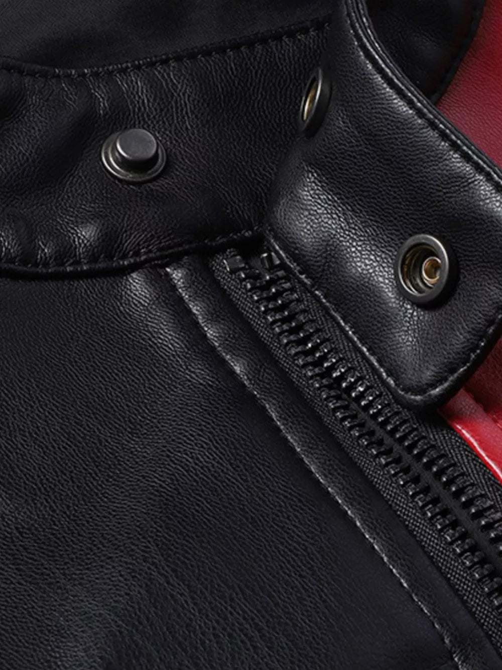 Black leather motorcycle jacket detail with zipper and snap collar.