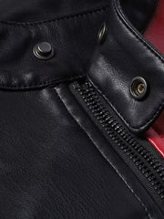 Black leather motorcycle jacket detail with zipper and snap collar.