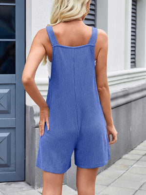 Royal blue ribbed romper overalls with white pinstripes and square neckline.