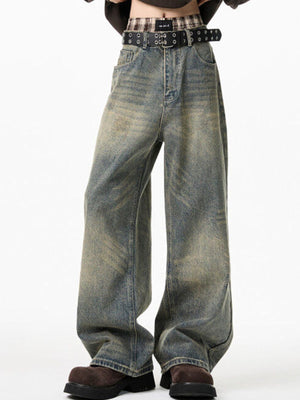 Men's belted wide-leg jeans in distressed blue cotton denim with a relaxed fit.