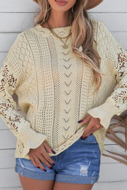 Yellow openwork knit sweater with lace sleeves and textured front detail.