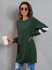 Dark Green sweatshirt dress with raglan sleeves and white varsity stripes on arms.
