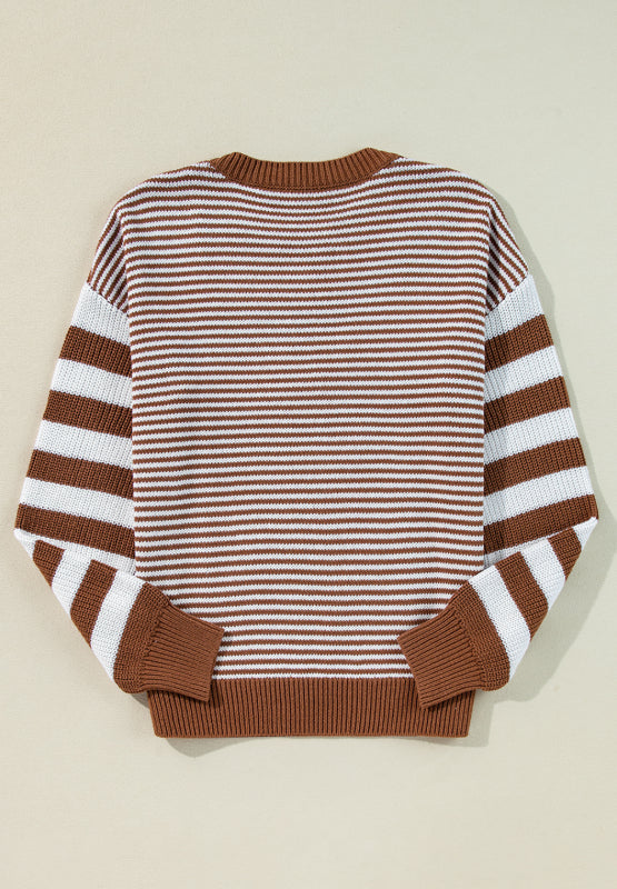 Geometric stripe knit sweater in brown and white acrylic with crew neck and long sleeves.