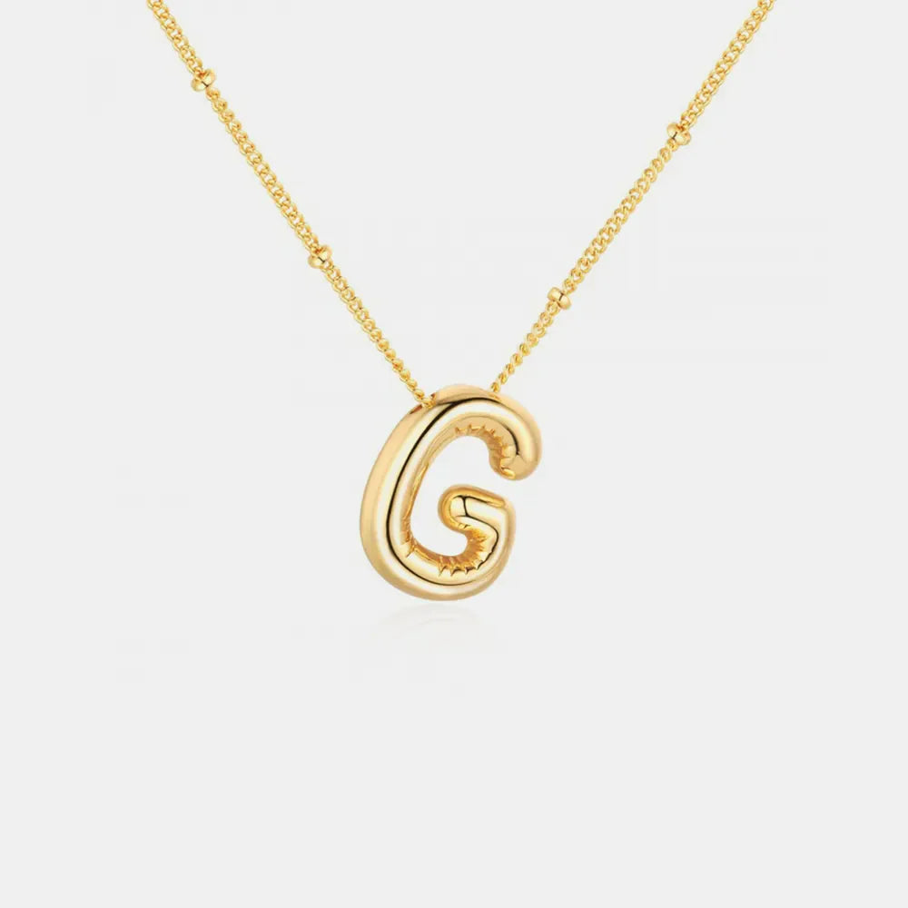 Gold initial pendant necklace with bubble letter G and beaded chain