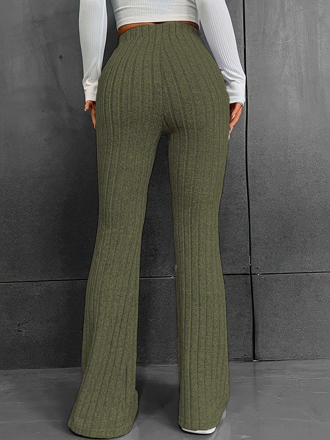 Sculpted ribbed flare trousers in Matcha Green, made of 100% polyester, with a high waist and bootcut leg.
