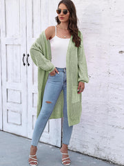 Light Green ribbed knit maxi cardigan with pockets and balloon sleeves, styled with a white cami and jeans.