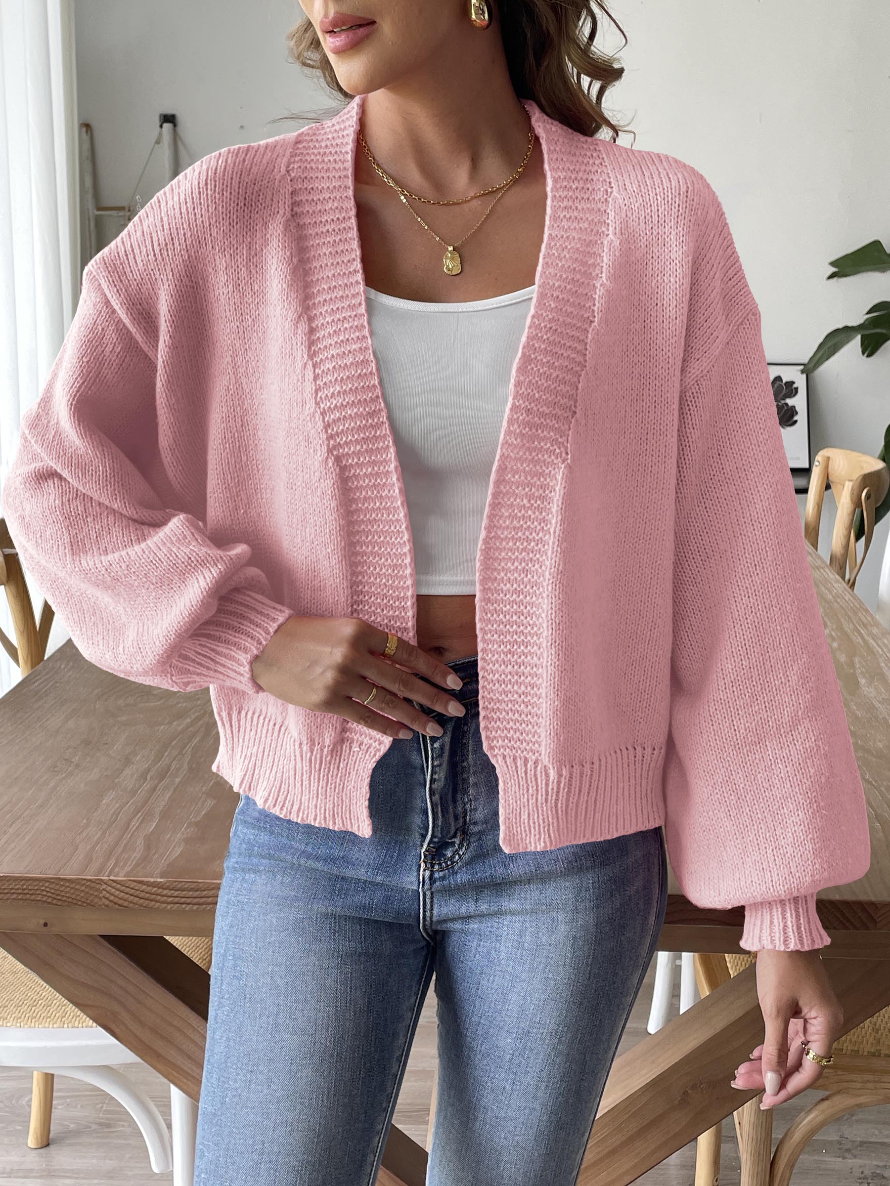 Dusty pink balloon sleeve knit cardigan with ribbed cuffs and hem.