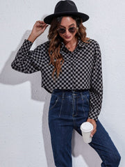 Checkerboard cropped shirt jacket in black and gray with button front and collar.