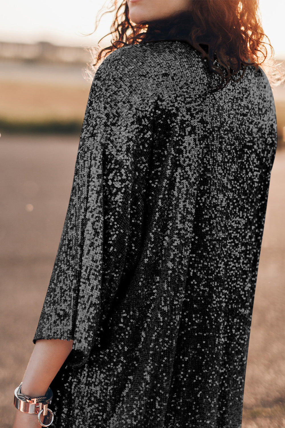Black sequin kimono jacket with wide sleeves and a relaxed fit.