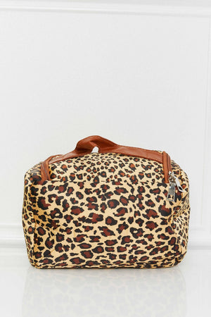 Leopard print travel organizer bag with brown trim and handle.