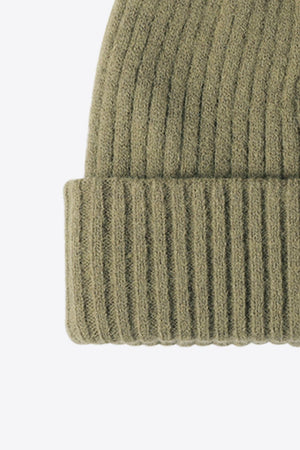 Green ribbed acrylic beanie with a cuffed hem