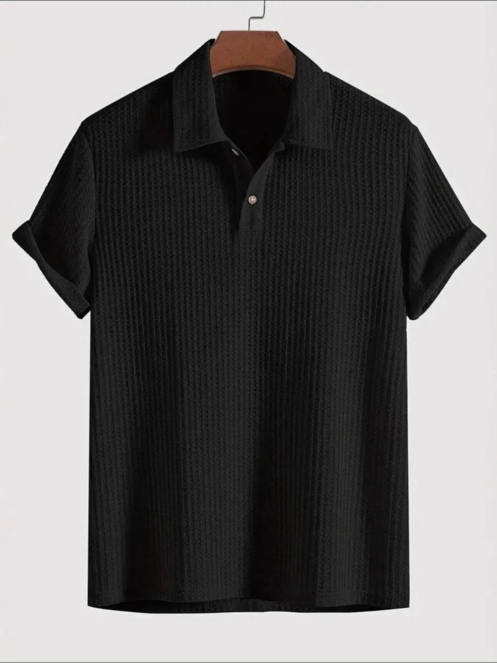 Black textured polo shirt with rolled sleeve detail