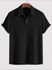 Black textured polo shirt with rolled sleeve detail
