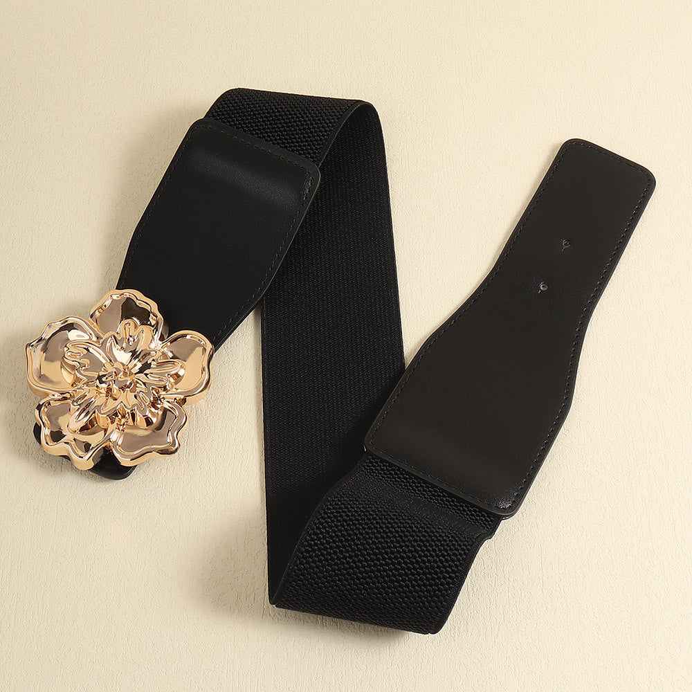 Black elastic cincher belt with gold floral buckle detail