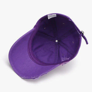 Purple distressed canvas baseball cap with adjustable strap and distressed details.
