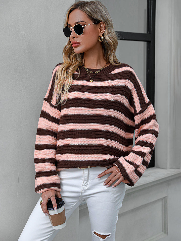 Chunky stripe relaxed fit knit sweater in brown and pink acrylic with crew neck and long sleeves.