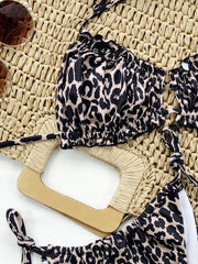Leopard print bikini set with ruffled cups and tie details.