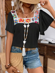 Black embroidered square neck flutter blouse with colorful floral detail.