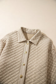Beige diamond quilted oversized button-up jacket with a collared neckline and button closure.