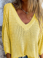 Yellow open-knit V-neck sweater with slouchy fit and detailed stitching.