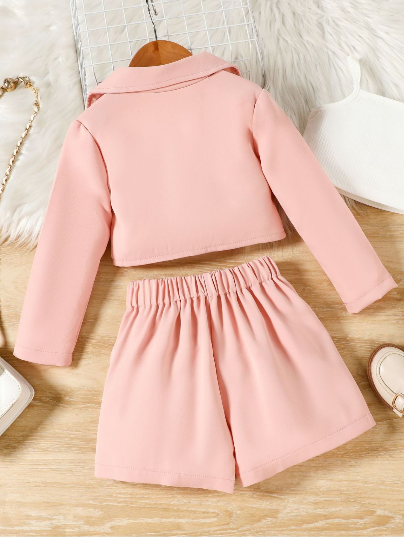 Toddler pink three-piece cami set with a blazer and shorts.
