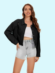 Black distressed denim trucker jacket with crystal fringe detail.