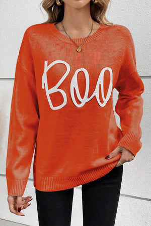 Orange crewneck sweater with white "Boo" appliqué and ribbed cuffs and hem