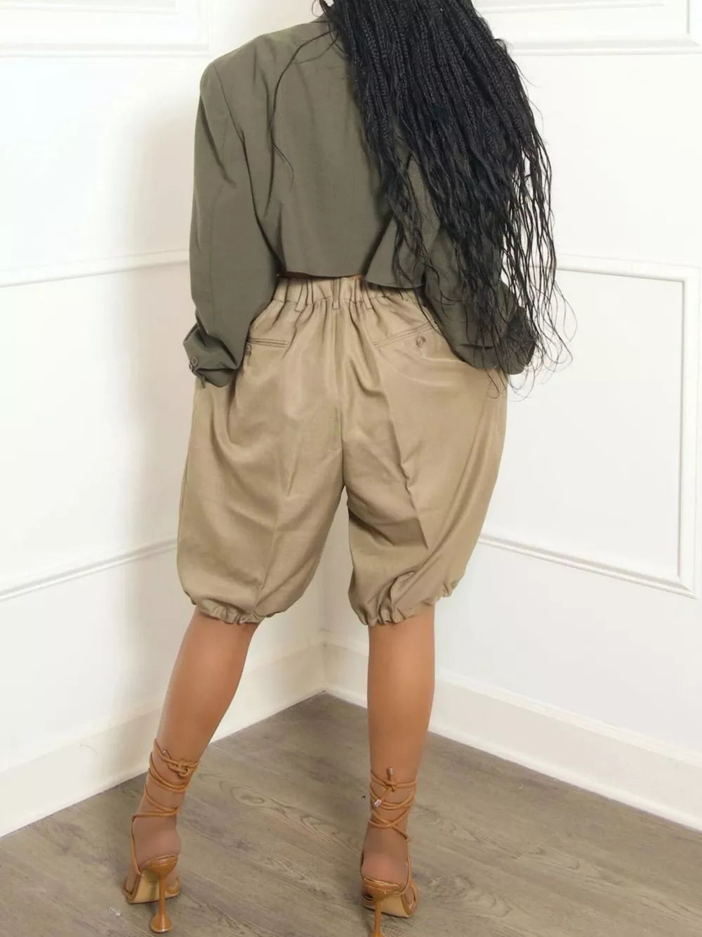 Khaki pleated high-waisted shorts with drawstring and elasticated cuffs.