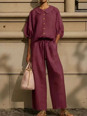 Burgundy two-piece set with button-down top and wide-leg pants, featuring a Peter Pan collar and drawstring waist.