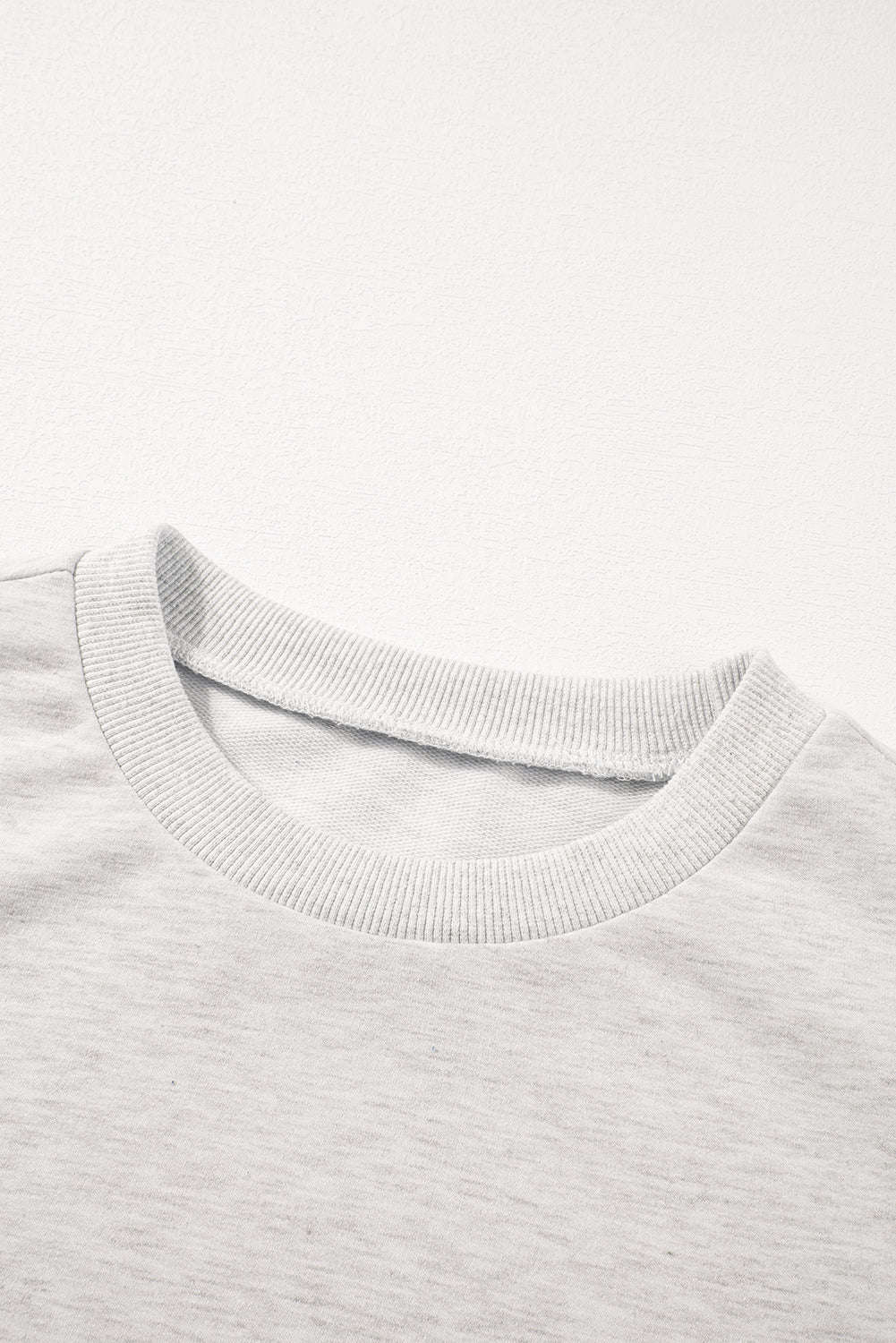Light gray embellished sweatshirt with crew neck and ribbed trim