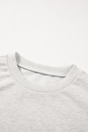Light gray embellished sweatshirt with crew neck and ribbed trim