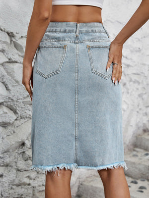 Light blue denim pencil skirt with frayed hem and back pockets.