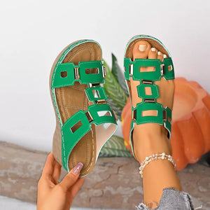 Green open-toe wedge sandals with decorative gold accents and comfortable cushioned footbed.