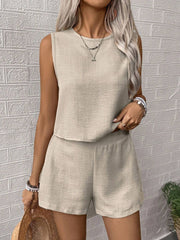 Beige textured linen tank top and shorts set with round neckline and elastic waist shorts.