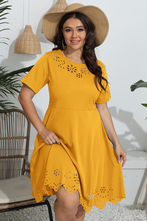 Mustard yellow midi dress with laser cutouts on neckline and hem