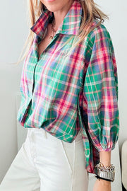 Voluminous plaid blouse with gathered sleeves and a pointed collar, styled with white jeans.