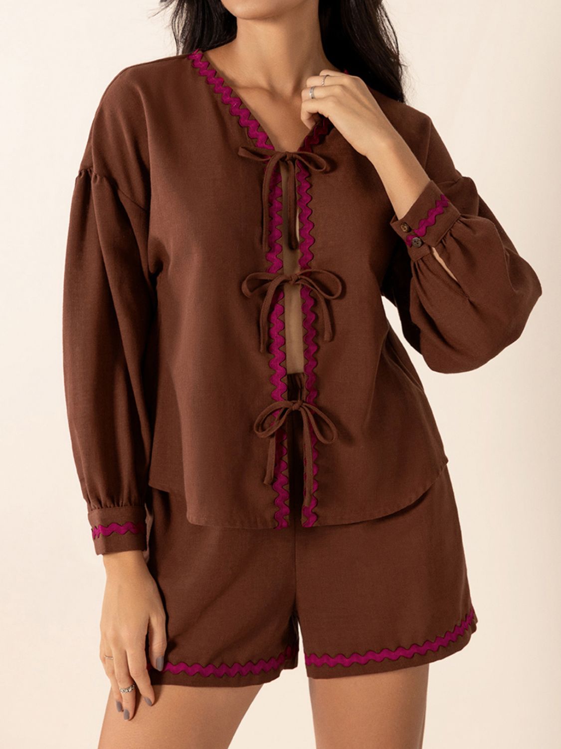 Brown linen tie-front pajama set with scallop trim and balloon sleeves.