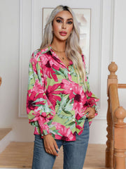 Floral print button-up blouse with blouson sleeves and smocked cuffs.
