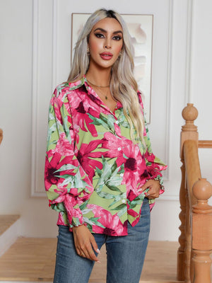 Floral print button-up blouse with blouson sleeves and smocked cuffs.
