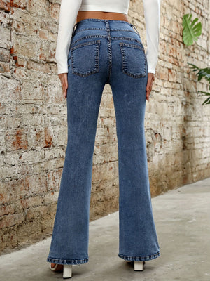 Medium wash cotton bootcut jeans with a sculpted waist and five-pocket styling.