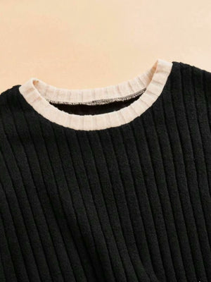 Black ribbed knit loungewear set with contrast tan neckline detail.