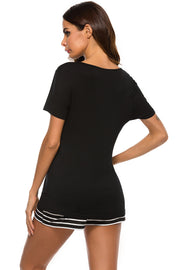 Black graphic tee with striped shorts pajama set