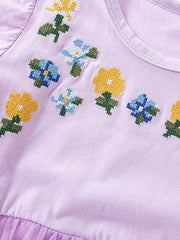 Toddler lavender dress with embroidered floral pattern and tulle trim.