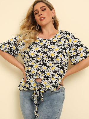 Daisy print blouse with ruffle sleeves and front knot detail.