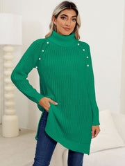 Green ribbed turtleneck tunic with pearl buttons on shoulders, side slits, and a cozy knit.