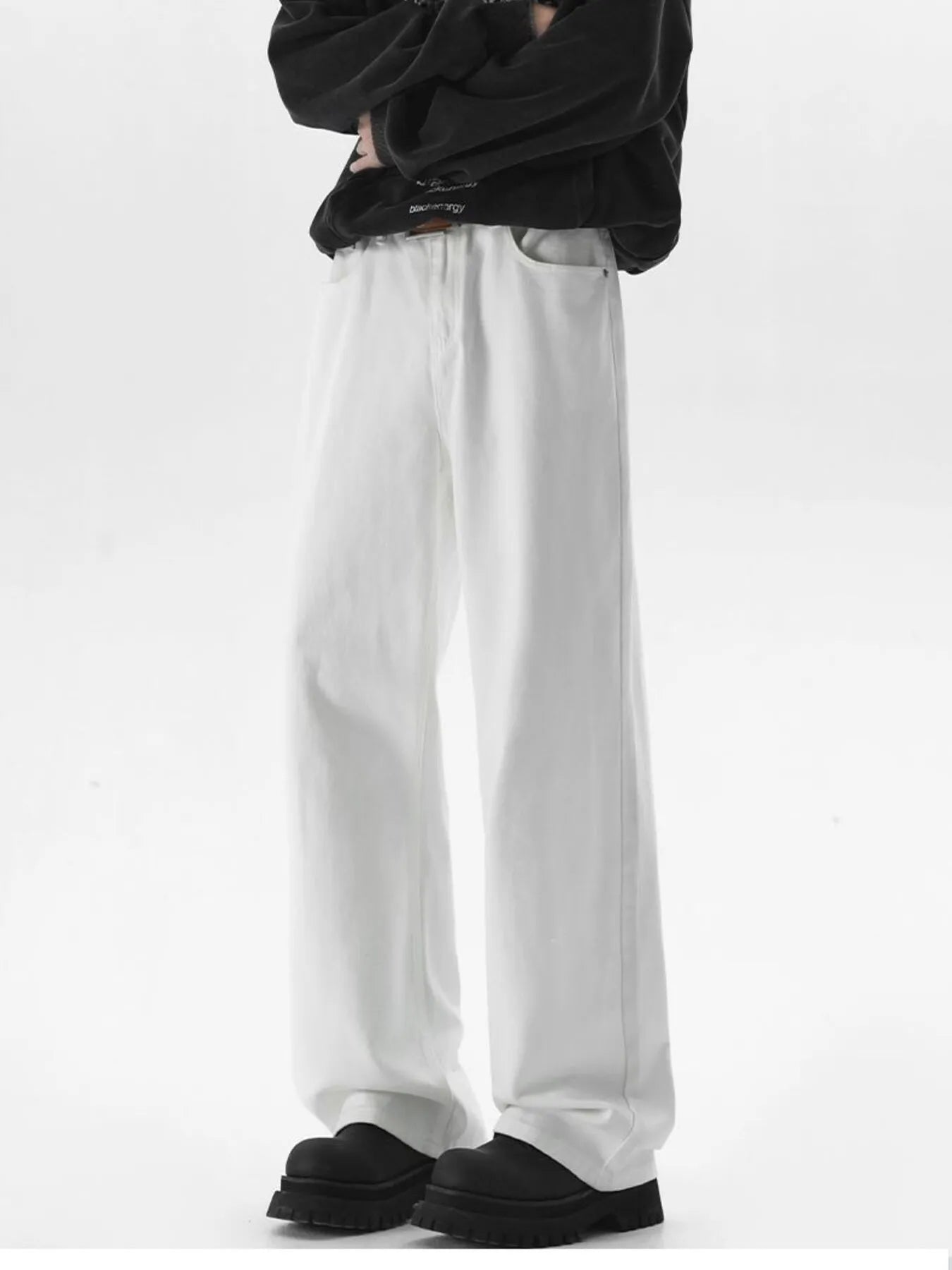 White wide-leg jeans with a comfort fit, cotton blend material, and a relaxed silhouette.
