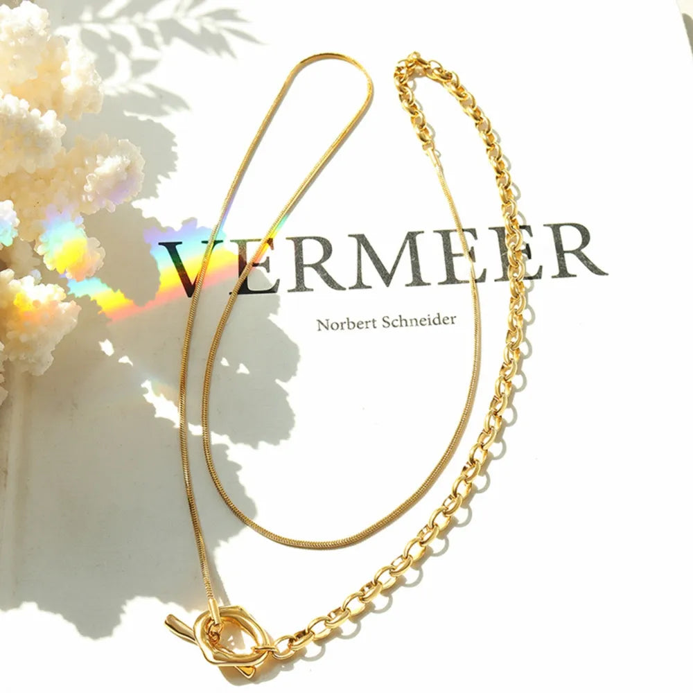 Gold asymmetrical chain and bar necklace with toggle clasp