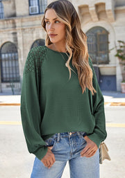 Green waffle knit raglan top with lace yoke detail and crew neck.